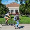 Students walking and biking on campus
