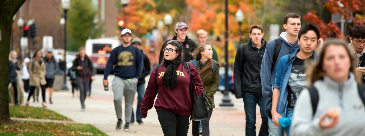Students walking to class on a fall day.