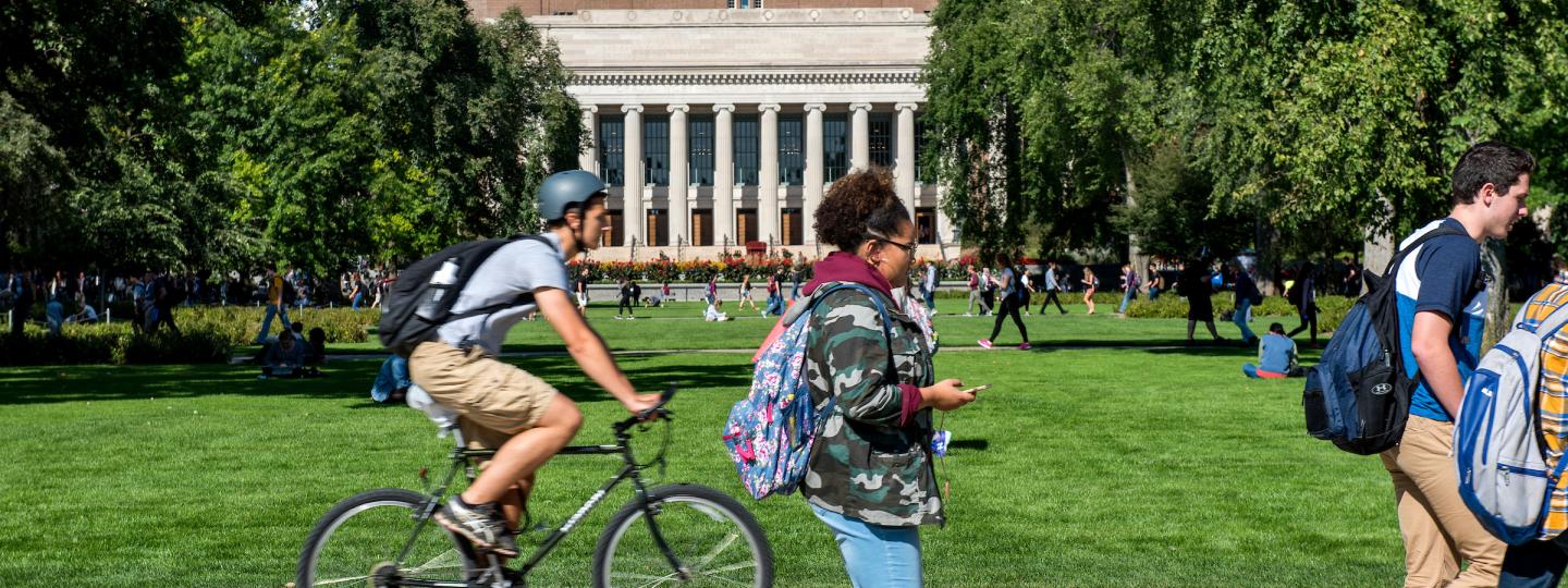 Students walking and biking on campus