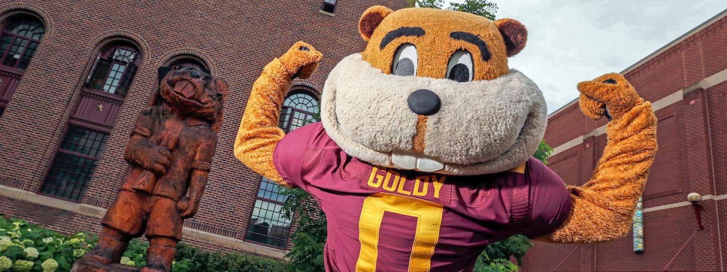 Goldy mascot with its head turned around "looking" backwards