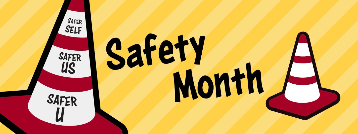 The words "Safety Month" appear in between two parking cones. One also has the phrases "Safer self," "Safer Us,: and "Safer U."