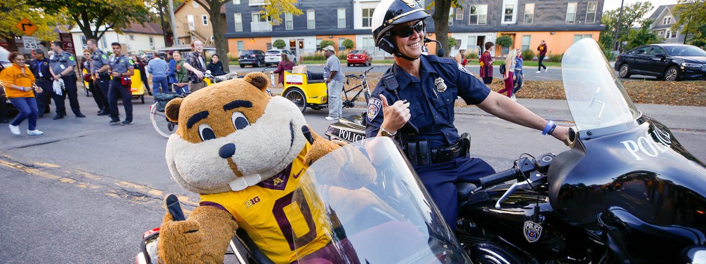 goldy in the side car of a police motorcycle 