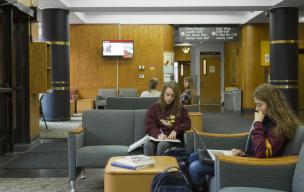 Student's lounging in centennial hall's lobby.