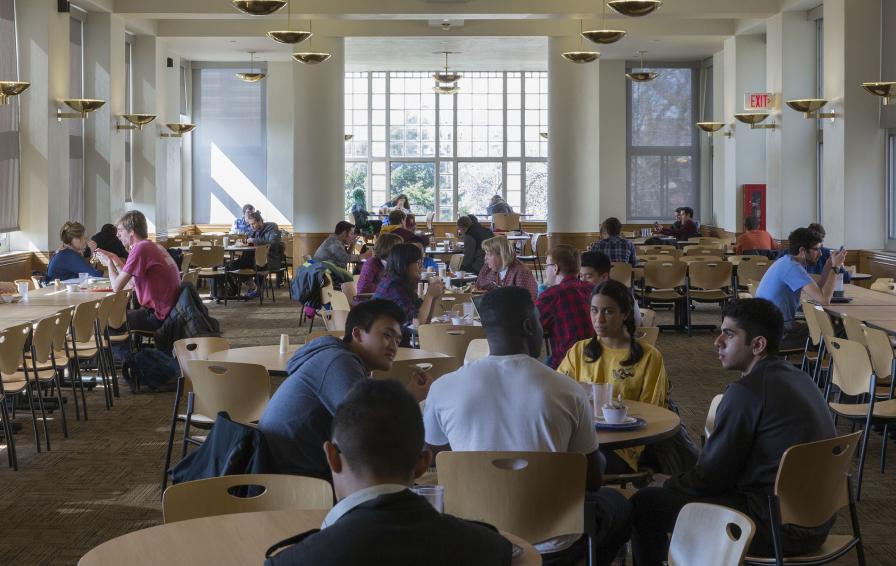 Students eating in comstock's dining area.